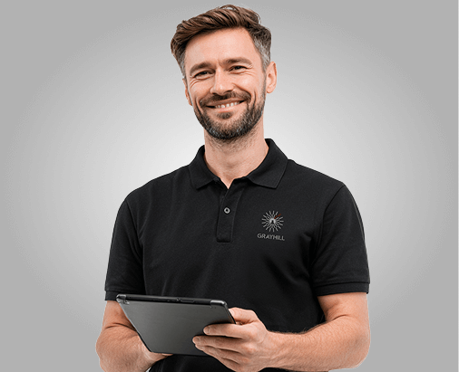 Grayhill support representative smiling and holding mobile tablet.